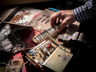 close up hand electric board circuit repairing