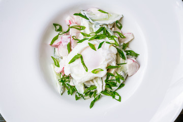 Vegetable salad with poached egg