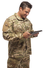 Smiling Army Soldier with tablet in hand