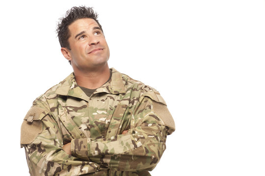 Army soldier smiling and looking up