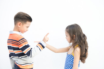 Young brother and sister portrait. Pre teen boy and girl together. Happy Angry fighting together pose. Outdoor take.