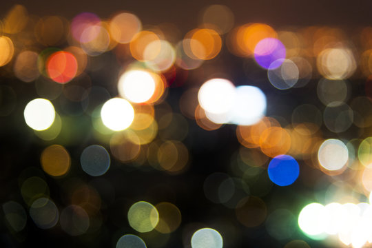 Blurred street bokeh lights at night time