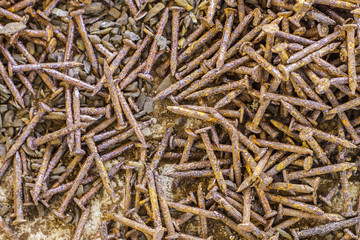 Pile of old rusty screw heads, bolts, metal nuts,Abstract metall background.