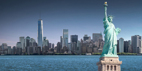 The Statue of Liberty with high-rise building in Lower Manhattan background, Landmarks of New York...