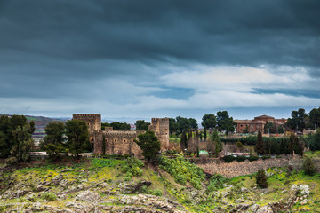 Fototapeta na wymiar Castle of San Servando under storm clouds