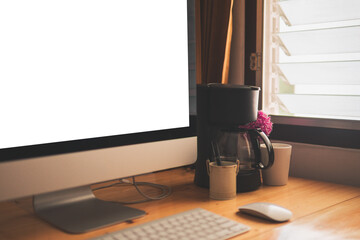 office wood table with computer keyboard, mouse, cup of coffee side of window and clean tone. office work space concept