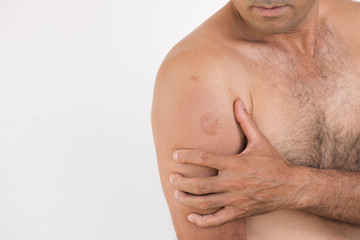 Closeup man elbow and arm pain and injury on white background. Health care and medical concept.