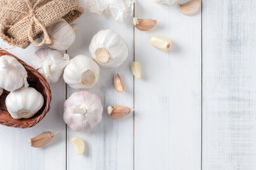 Fototapeta na wymiar Top view of Garlic on white wood background