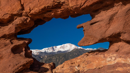 MARCH 8, 2017 - SIAMESE TWINS RED ROCKS AT GARDEN OF THE GODS SHOW PIKES PEAK VIEW, COLOARDO SPRINGS, CO, USA - a National Natural Landmark showing Sedimentary red rock formations