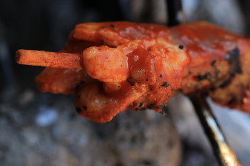 Sausages barbecue with a charcoal barbecue in the garden
