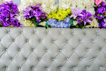 leather upholstery and flowers background
