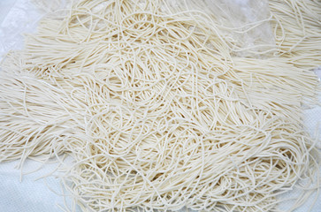 close up on raw noodles as food background