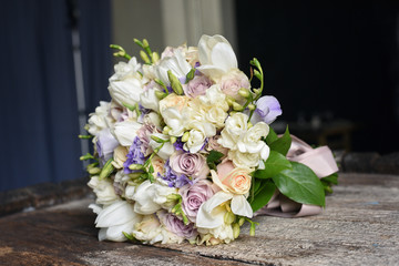 beautiful summer wedding bouquet on wooden desk