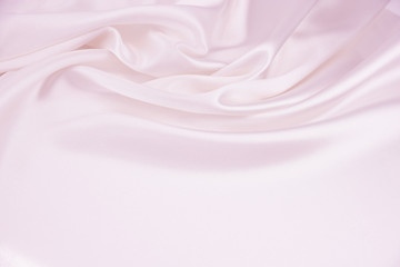Obraz premium The texture of the satin fabric of pink color for the background 