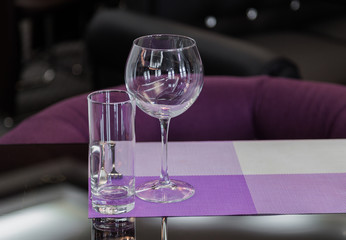 Table service in the restaurant. Transparent clean glasses and wine glasses.