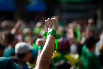 People raised hand air fighting for protest