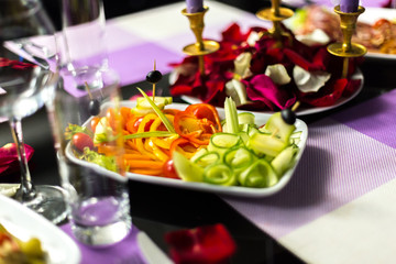 Naklejka na ściany i meble Served holiday table with different tasty dishes