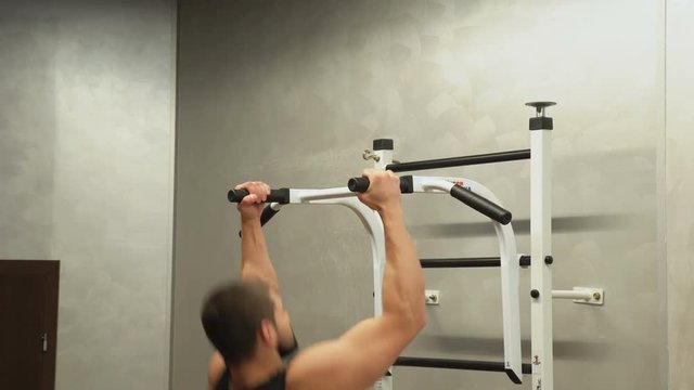 sport bodybuilding gym workout. athlete lifestyle. health fitness strong body concept. man doing neutral grip pull ups