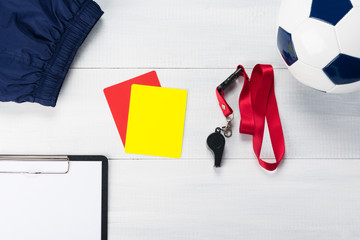 set of things for the referee for a football match against a light background