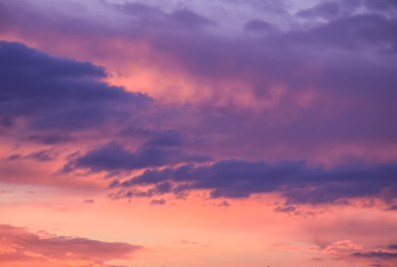 Naklejka na ściany i meble romantic sunset with clouds as background