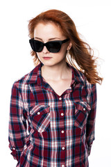 Obraz premium Beautiful woman with sunglasses in plaid shirt