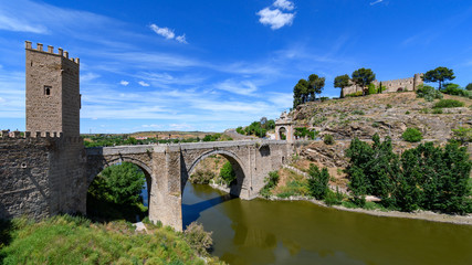 Fototapeta na wymiar Alcantara Bridge, view from the defensive walls of Toledo