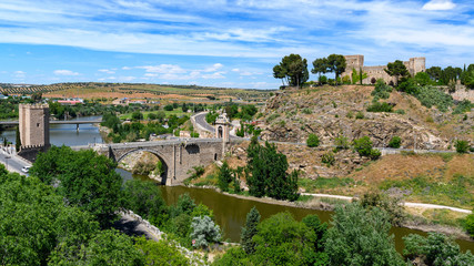 Fototapeta na wymiar Alcantara Bridge, view from the defensive walls of Toledo