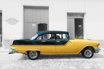 Yellow taxi in the streets of Trinidad Cuba