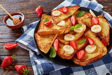 french toasts on a black plate