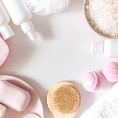 Soft light bathroom decor for advertising, design, cover. Towels, soap, massage brush, sea salt, salt bomb, cosmetic bottles. Aromatherapy, body care, aroma massage. mock up. Flat lay, top view, copy 