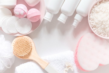 Soft light bathroom decor for advertising, design, cover. Towels, soap, massage brush, sea salt, salt bomb, cosmetic bottles. Aromatherapy, body care, aroma massage. mock up. Flat lay, top view, copy 