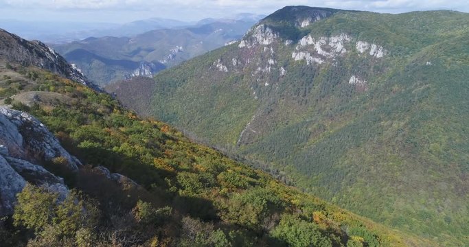 Aerial view of man standing on the edge of mountain - Transylvania