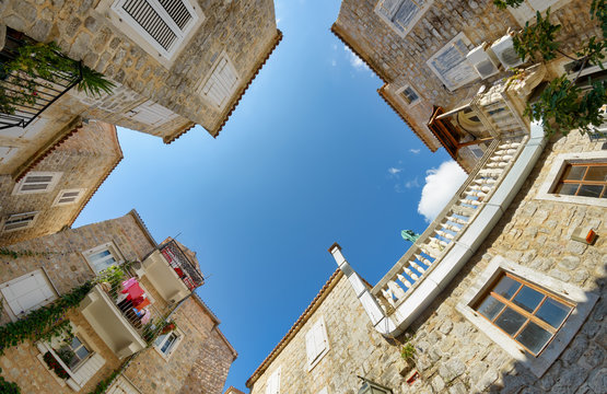 Small piazza with stone houses in the Old Town of Budva, Montenegro, Europe 