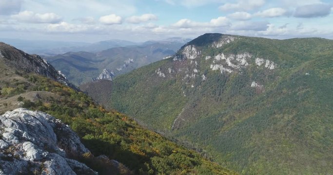 Aerial view of man standing on the edge of mountain - Transylvania
