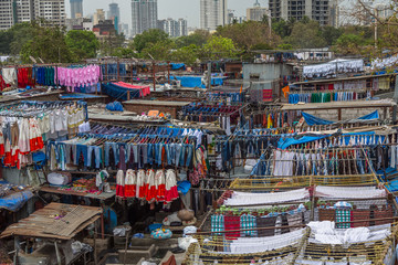 Fototapeta na wymiar Dhobi Ghat Mumbai Laundry. Dhobi Ghat is a well known open air laundromat in Mumbai, India. The washers, known as dhobis, work in the open to clean clothes and linens from Mumbai's hotels and hospital
