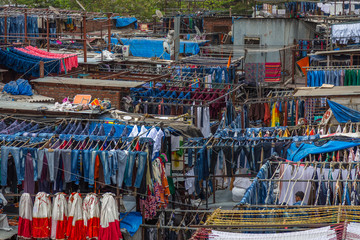 Dhobi Ghat Mumbai Laundry. Dhobi Ghat is a well known open air laundromat in Mumbai, India. The washers, known as dhobis, work in the open to clean clothes and linens from Mumbai's hotels and hospital