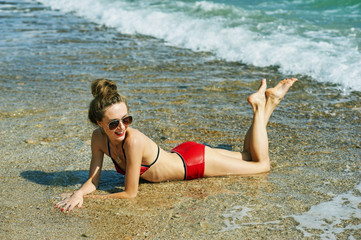 Young woman resting on the coast