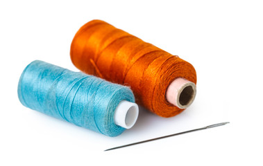 coils with colorful thread