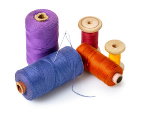 coils with colorful thread