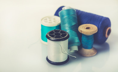 coils with colorful thread