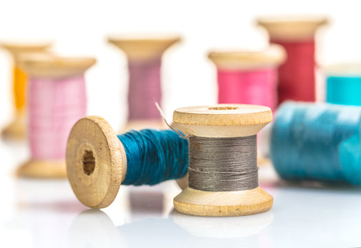 coils with colorful thread