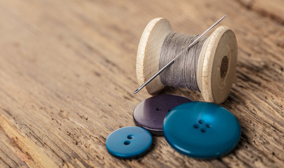 spool of threads and buttons