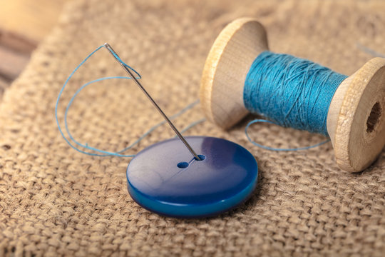 button with needle and thread