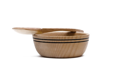 Wood bowl plate with wooden spoon isolated on white background. Kitchenware.