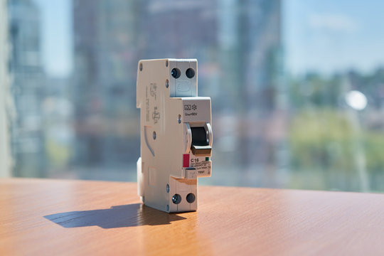 On the table there is an automatic switch of differential current in a compact design. The device protects human life from electric shock. Modern technologies of electrical equipment.