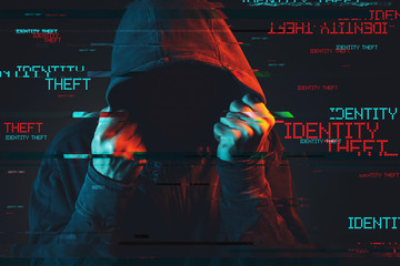 Online identity theft concept with faceless hooded male person