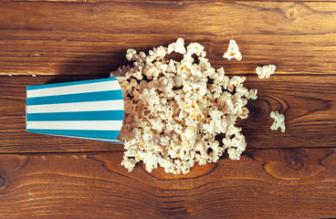 Salt popcorn on the wooden table