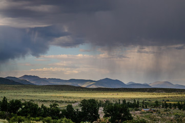 Threatening skies over mono lake, California, as an early evening thunderstorm is rolling in. Image...