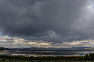 Naklejka na ściany i meble Threatening skies over mono lake, California, as an early evening thunderstorm is rolling in. Image from an early August late afternoon, near Lee Vining, California.