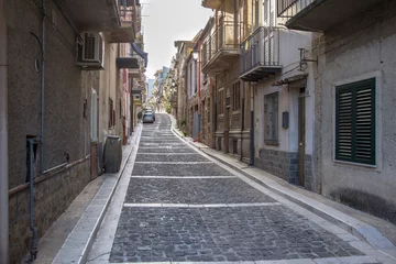 Fototapete Narrow street of Lascari in Sicily, Italy © robertdering